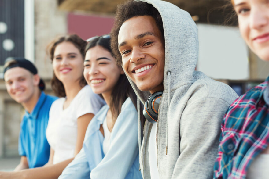 Group of young people outside smiling