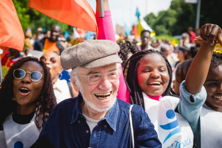 Group of diverse people at a parade smiling