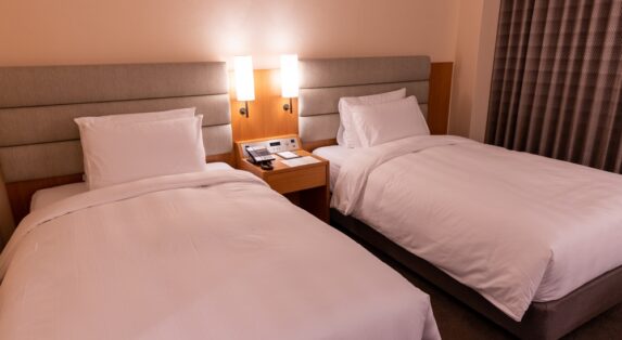 Operation Maximise: Room Sharing in Hotels